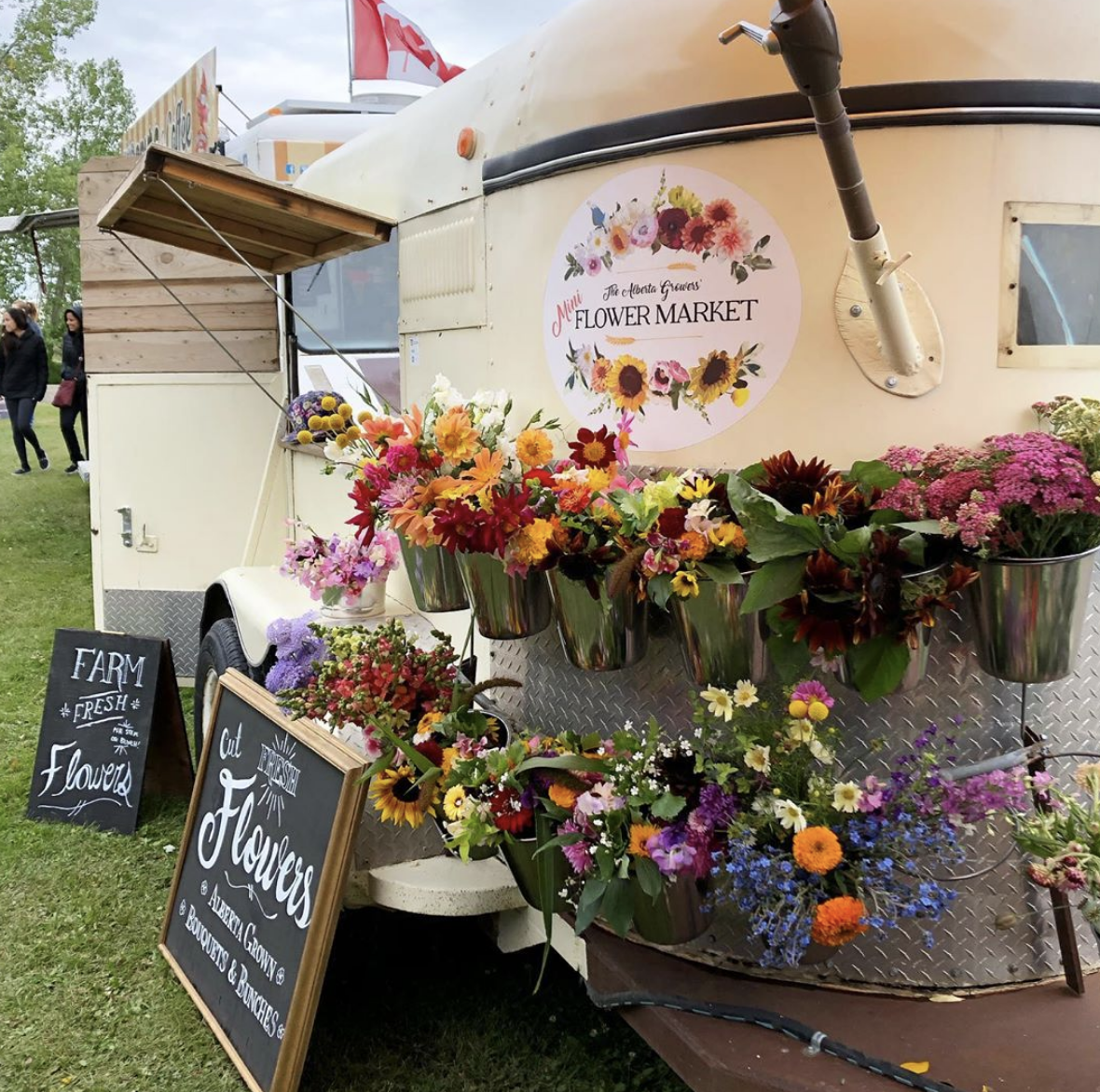 Adams converted an old horse trailer into a pop-up flower shop, pictured here at the Okotoks Farmer's Market