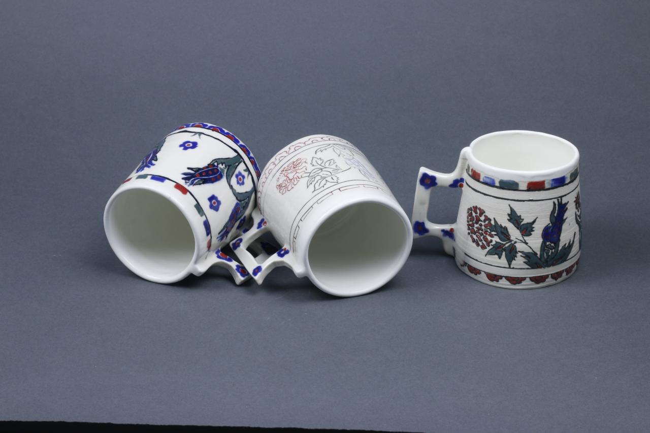 Ceramic mugs with Iznik-inspired floral patterns by Shermin Muzaffa.