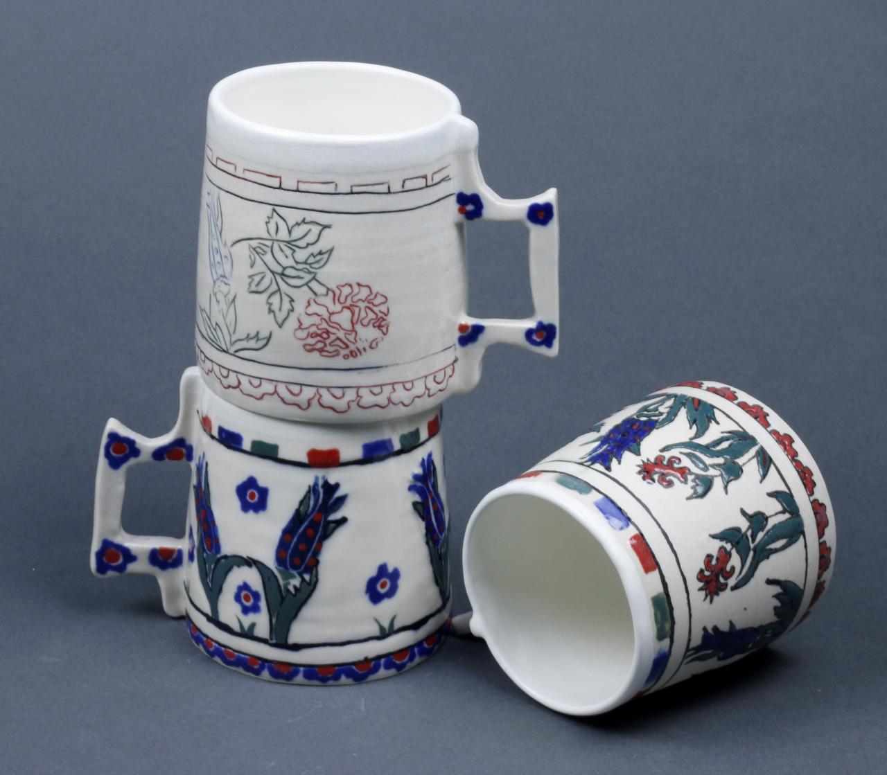 Ceramic mugs with Iznik-inspired floral patterns by Shermin Muzaffa.
