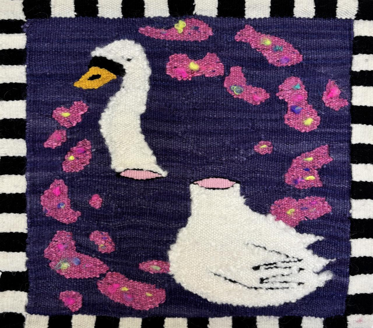 Tapestry weaving of a white swan surrounded by pink shapes on a dark background, by Leaf Guillas, Asymmetrical Sweetie.