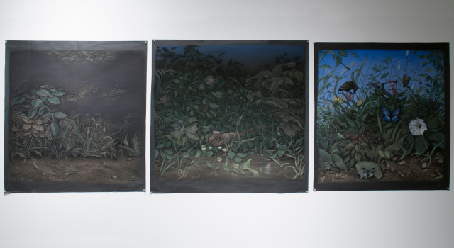 Detail of Triptych (2013). The three square pastel drawings depict a transistion from night to day with a flourishing floral scene in the foreground. The middle image features a hand gripping some drooping flowers.  