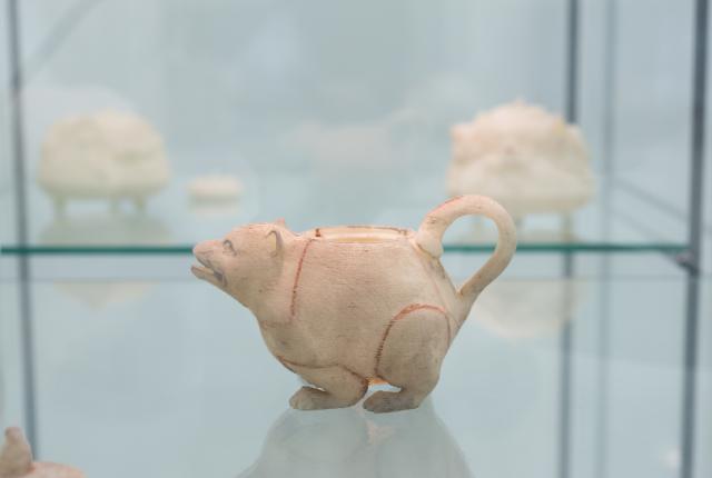 Small badger teapot from the tall glass display case. 