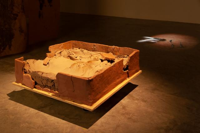 Tomo Ingalls. Constraint, 2021. Raw clay. Smashing, 2022. Video Projection. Photo Credit Leia Guo. 