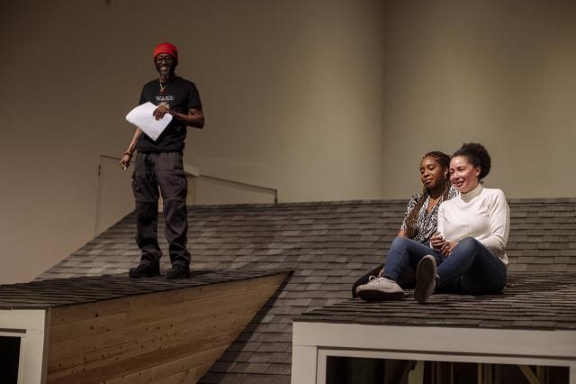 Wakefield Brewster, Adetola Adedipe, and Tanecia Cromwell performing at spoken word event