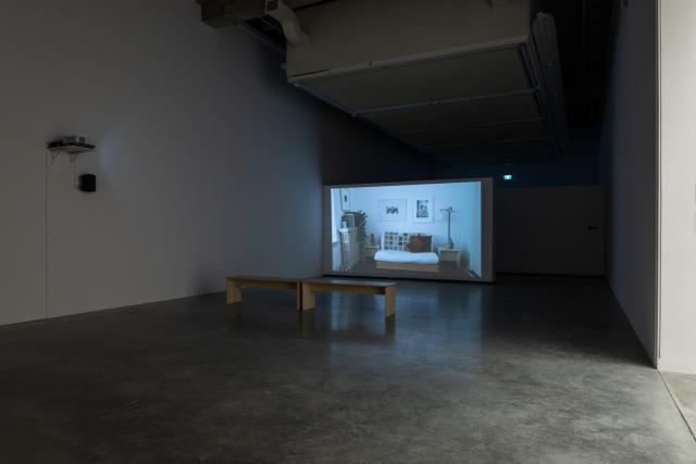 The Beyond Within video being shown in a darkened gallery