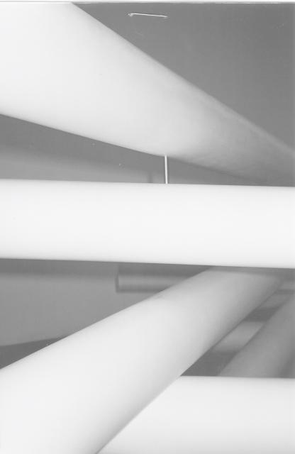 Paul Jackson, detailed view, Appendix A: The Detour, 2004. Long white pipes intersecting with each other in grayscale. 