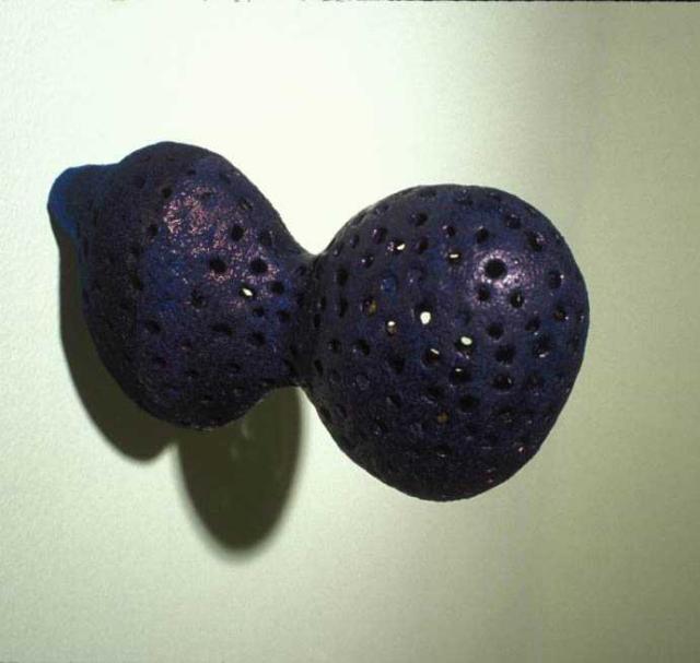 Jim Shrosbree, work detail, 2004. Sculptural work composed of a purple bulbous form affixed to a white wall. 