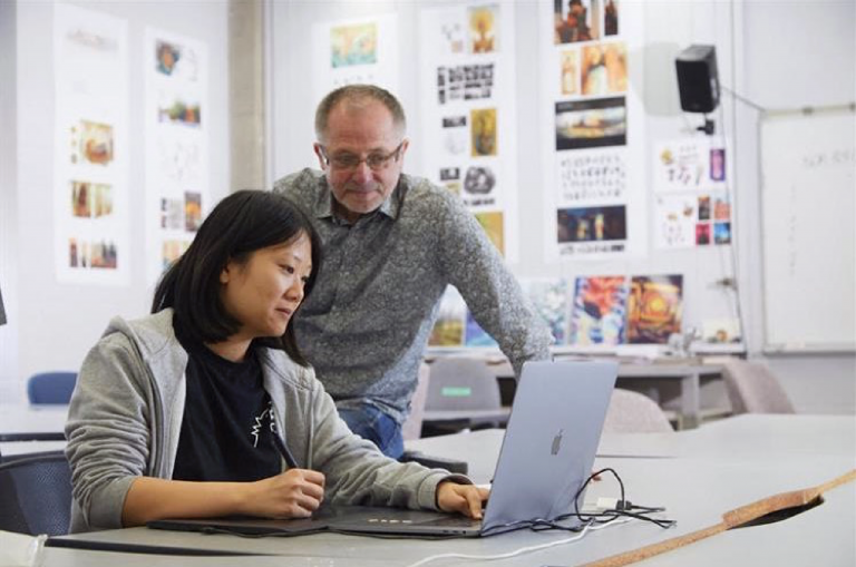 teacher helping student