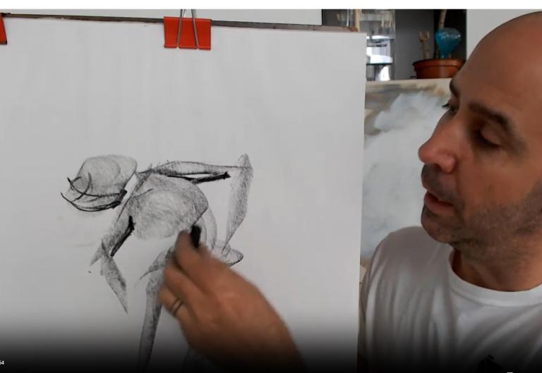 Introduction to drawing photo depicting instructor drawing an example of a gesture drawing 